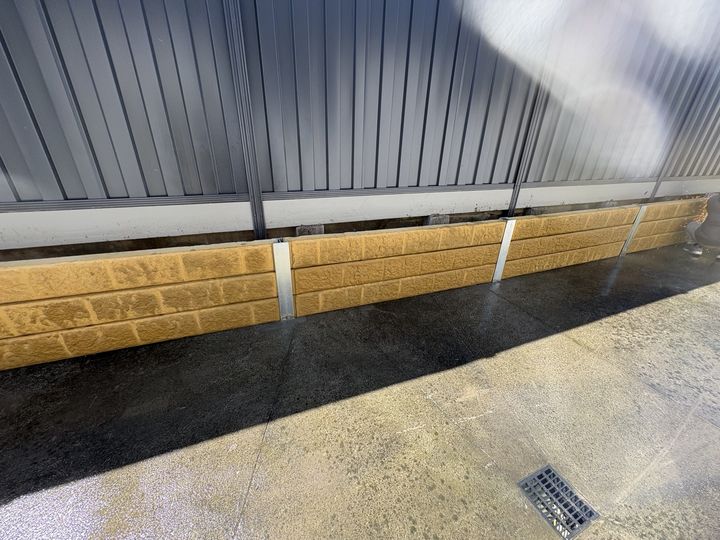 Colorbond fence with concrete sleepers by HD Fencing