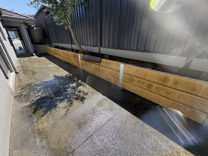 Colorbond fence along a driveway by HD Fencing