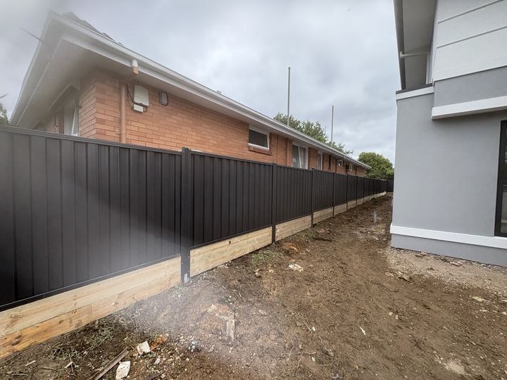 Monument fence with sleeper base by HD Fencing