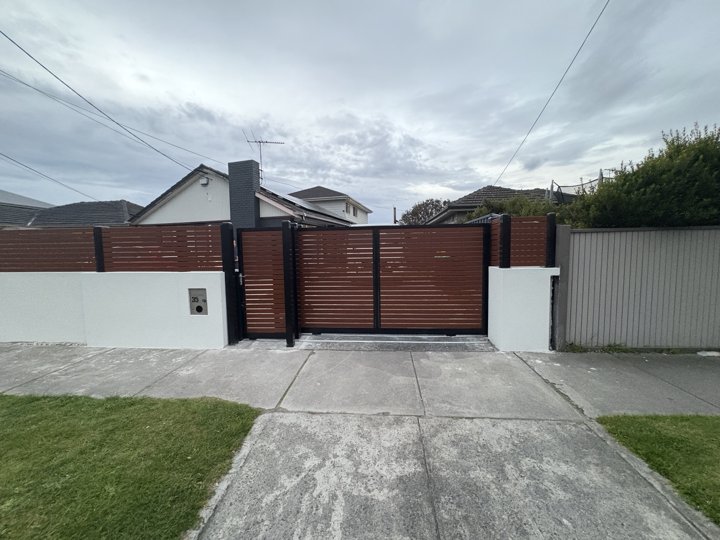 Slat driveway gates by HD Fencing