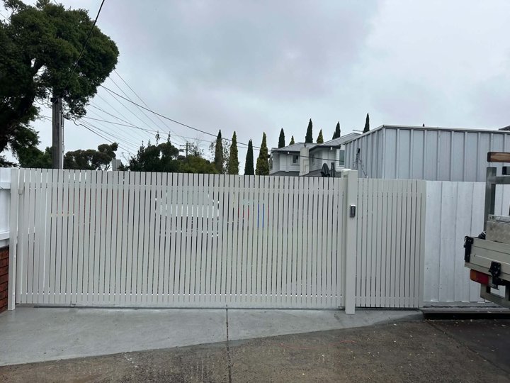 White vertical driveway gate by HD Fencing