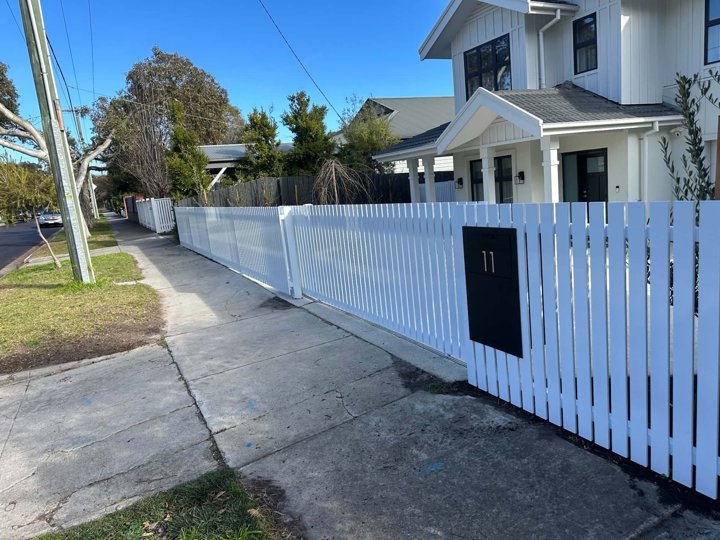 White front fence with letterbox by HD Fencing