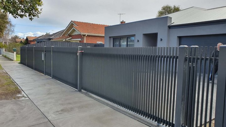 Dark vertical front fence and gate by HD Fencing