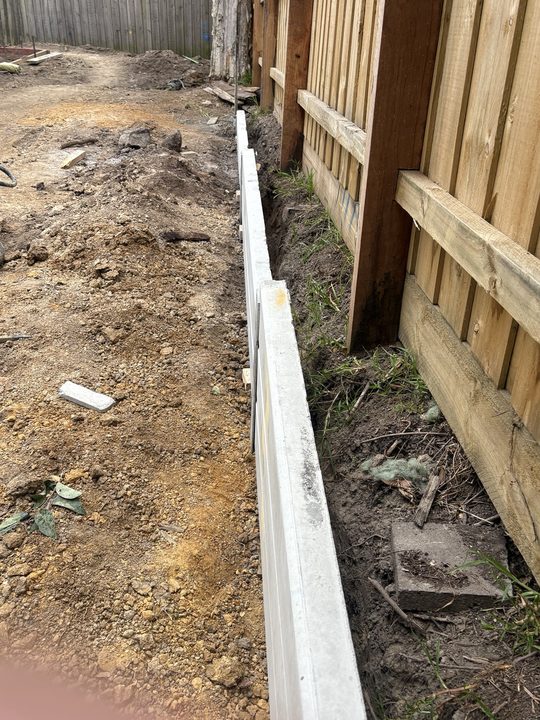 Timber retaining wall in progress by HD Fencing